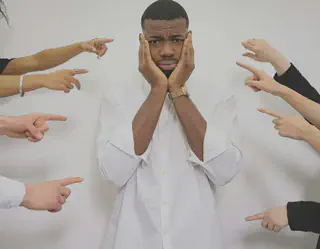 Man Holding Face With Pointing Fingers