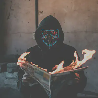 Man in Mask with Burning Newspaper
