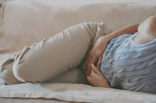 Person Holding Stomach