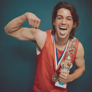 Man Flexing Muscles with Trophy