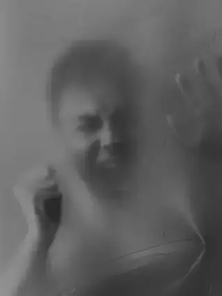 Person Screaming Behind Glass