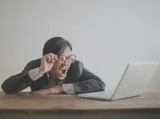 Man Yelling at Laptop