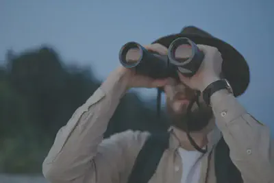 Man Looking Through Binoculars