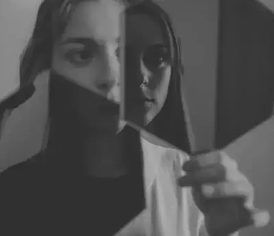 Black and White Woman in Mirror