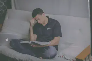 Man Reading on Couch