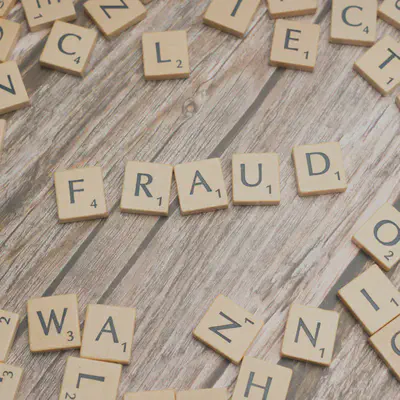 Scrabble Letters Spelling Fraud