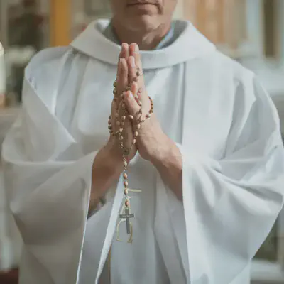Priest With Rosary Beads