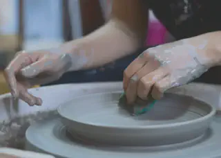 Person Making Clay Pot